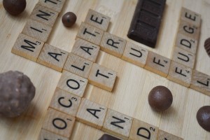 Scrabble Tiles Spelling Out Chocolate Related Words (Truffle, Fudge, Malt, etc.)